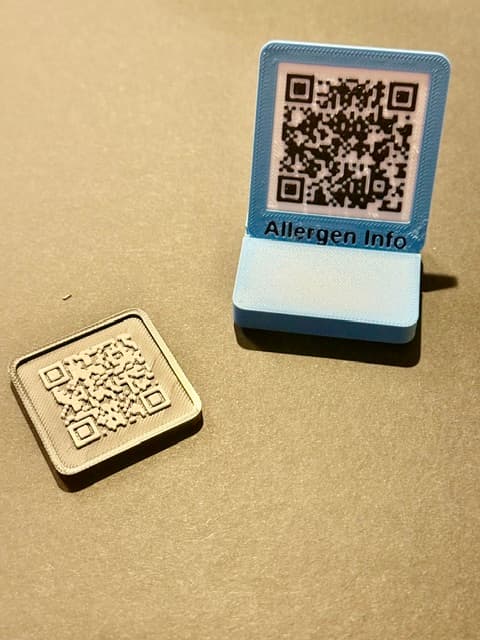 A printed custom QR code sign